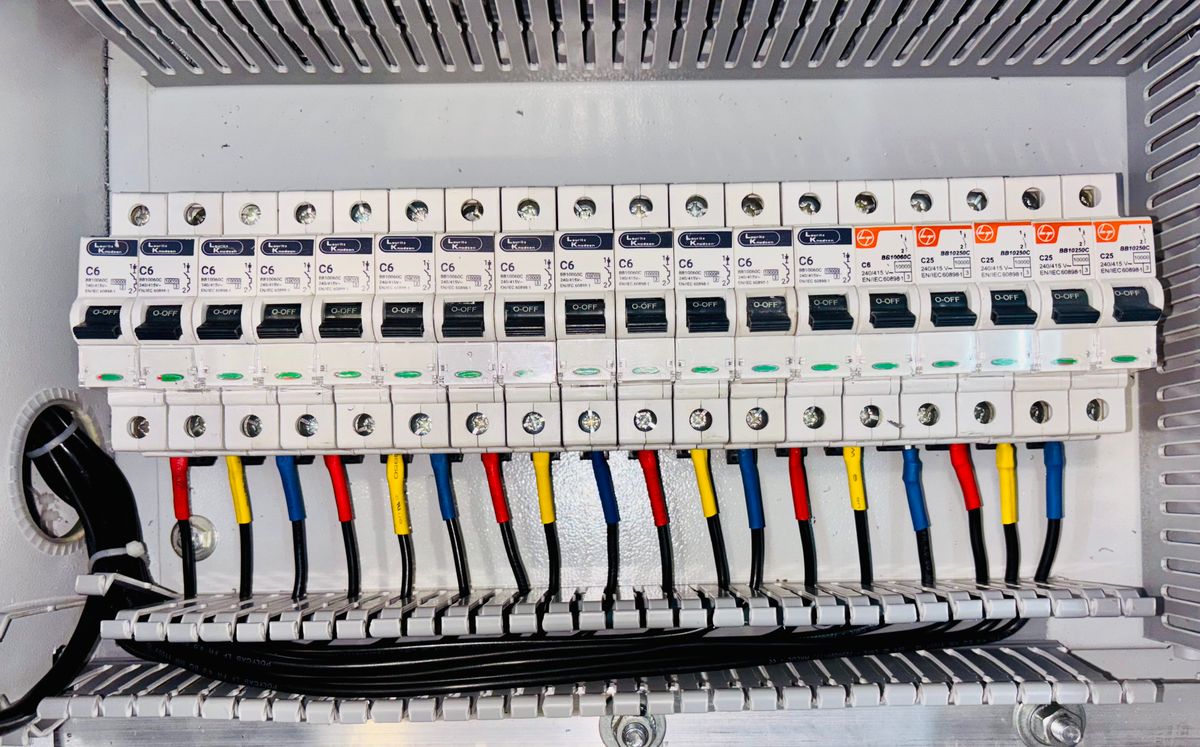A 200-amp breaker panel with neatly terminated, color-coded circuit wiring