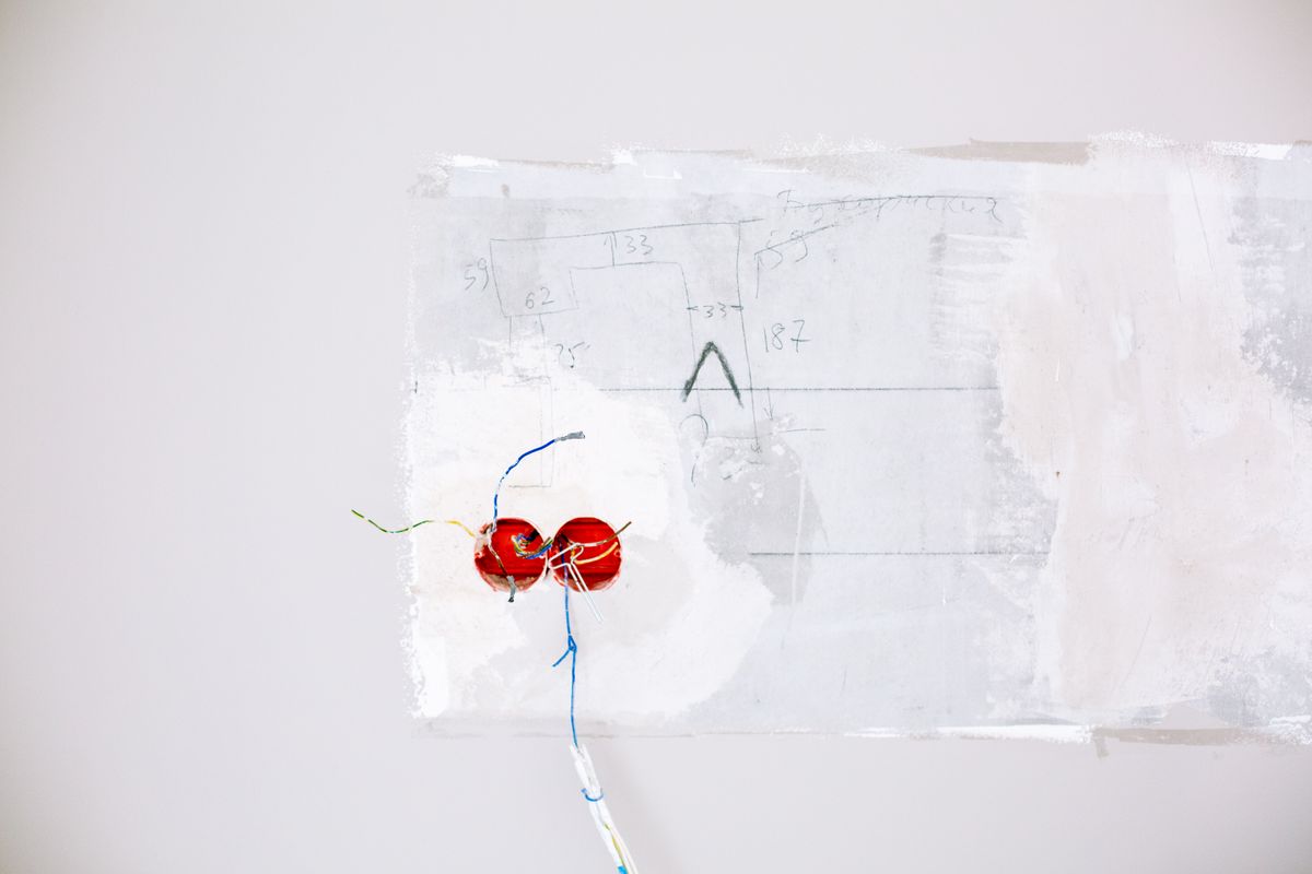 New electrical wiring rough-in run through a wall during a whole-home rewire
