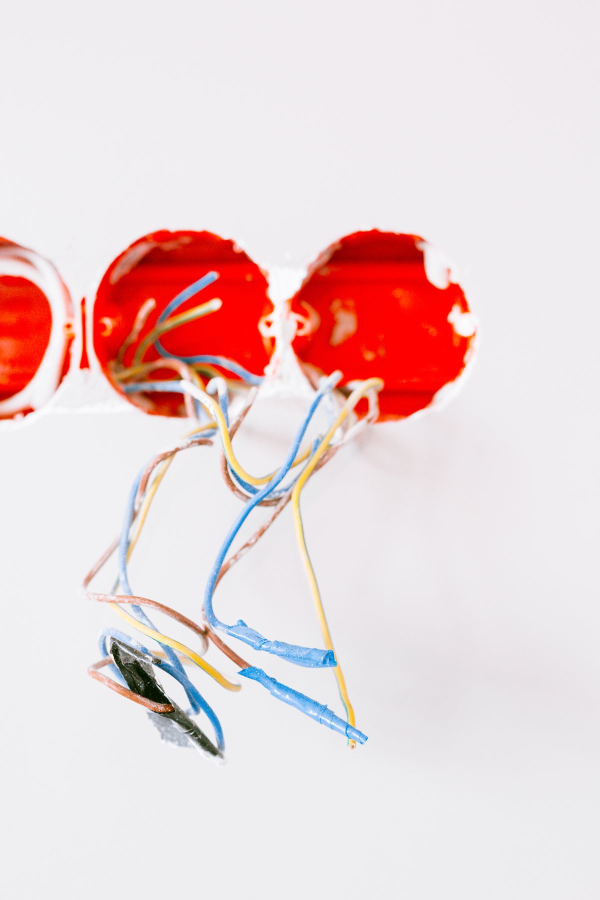 Fresh branch-circuit wiring fed from a wall during a full residential rewire